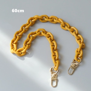 Detail view of 60cm ginger yellow resin phone chain with gold metal lobster clasps
