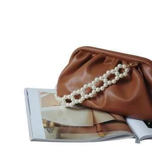 Brown pleated dumpling bag featuring a bold woven pearl chain strap for women