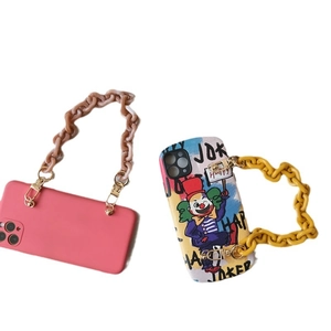 Fashionable candy color phone case with acrylic resin chain and metal hooks on white background