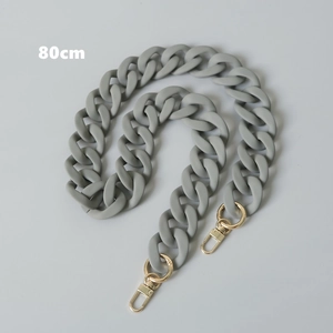 Detailed view of an 80cm matte gray resin chain strap with gold lobster clasps for bags