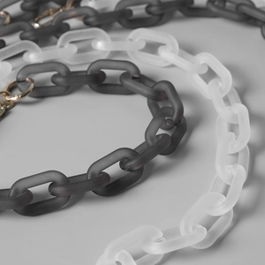 Vintage matte acrylic chain strap with black and white links and gold metal buckles