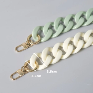 Fashionable acrylic resin chain bag straps in mint green and cream white with gold clasps