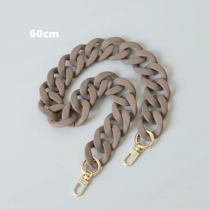 Close-up of a 60cm matte brown resin replacement chain with gold metal swivel buckles