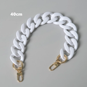 Detail view of 40cm cream acrylic bag chain with sturdy golden alloy lobster clasps