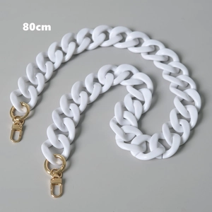 Detailed 80cm white acrylic resin bag strap with gold lobster clasps on gray background
