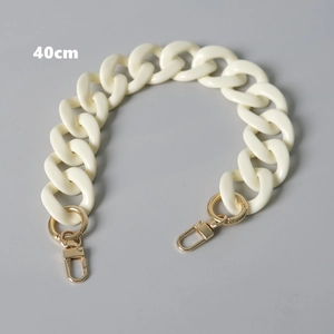 Detail of 40cm cream acrylic chunky chain strap with gold lobster clasps for handbags