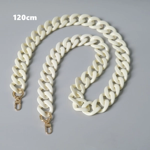 Detailed macro view of 120cm cream acrylic bag chain with gold lobster clasps