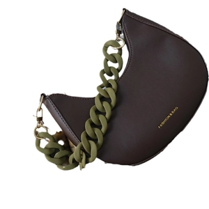 Dark brown crescent handbag with olive green chunky resin chain and gold text detail