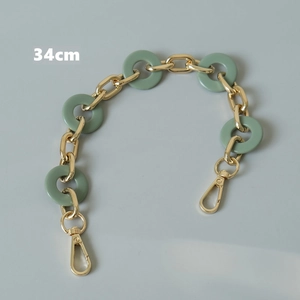 Detail of 34cm green resin acrylic chain with gold metal clasps for handbag decoration