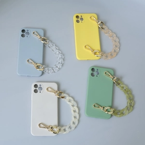 Detail of colorful fishbone acrylic chains on matte phone cases in four pastel shades