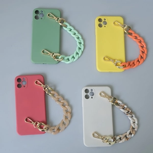 Detail showing acrylic fishbone phone chains in green, yellow, red, and beige colors