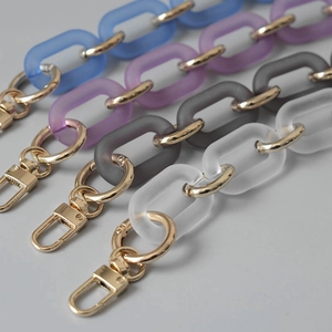 Detail of matte acrylic bag chains in four colors with golden metal spring ring clasps