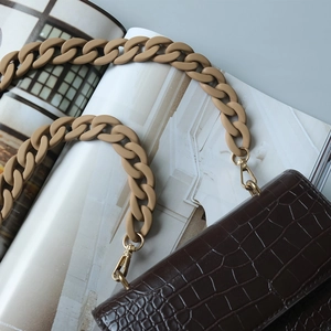 Brown crocodile leather handbag with matte camel acrylic chain strap and gold hardware