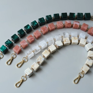 Detail of vintage square resin bag chains in four colors with gold lobster clasps