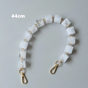 Detail of 44cm vintage acrylic resin bag chain strap with marble texture and gold lobster clasps