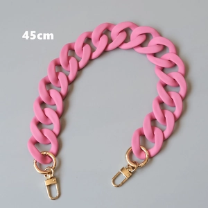 Close-up of 45cm matte pink acrylic chain strap with golden lobster clasps for handbags