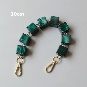 Close-up of 30cm dark green marble resin chain handle with gold lobster clasps