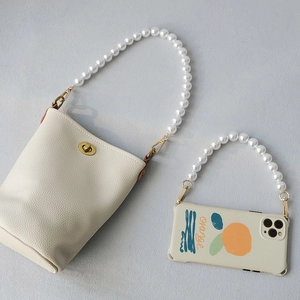 Elegant cream leather bucket bag and phone case set with pearl chain straps