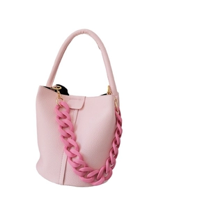Pink litchi grain leather bucket bag with chunky resin chain and gold hardware