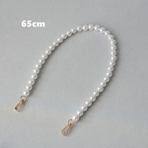 Detail of 65cm elegant white pearl bag strap with gold lobster clasps for handbags