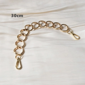 Detail view of 30cm gold metal handbag chain with chunky oval links and lobster clasps