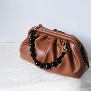 Vintage brown pleated cloud clutch bag with black beaded chain and gold metal buckle