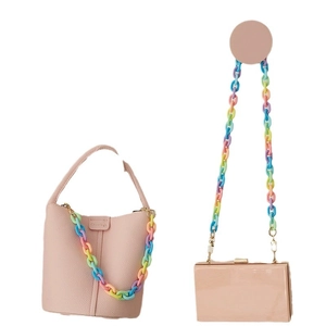 Pink bucket bag and clutch with colorful acrylic chain strap on white background
