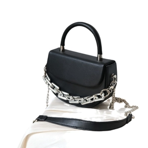 Chic black half-moon PU leather handbag with bold silver chain and detachable strap