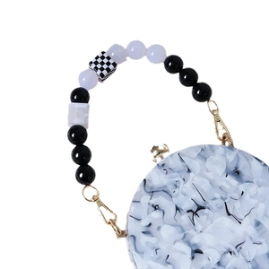 Vintage acrylic handbag with black marble pattern and checkered bead chain handle