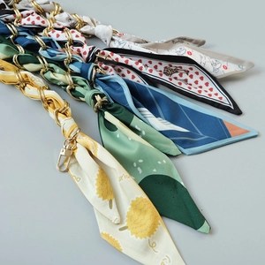 Detail of silk scarf bag straps with gold metal chains and lobster clasps for DIY handbags