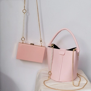 Pink pearl and metal chain crossbody bag with acrylic links for elegant women's purses