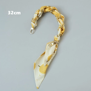 Detailed 32cm luxury bag strap featuring a gold chain interwoven with yellow floral silk