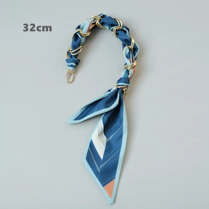 Close-up of 32cm silk scarf woven handbag chain with gold rings and spring clips