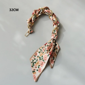 Close-up of 32cm silk scarf handbag chain with floral pattern and gold metal rings