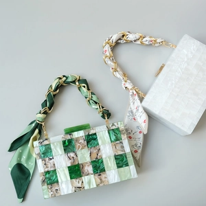 Elegant acrylic clutch bags with checkerboard patterns and silk scarf handle chains