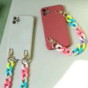 Detail of candy-colored acrylic resin chain and golden hooks on phone cases