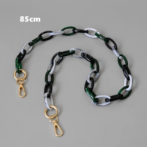 Detailed view of 85cm resin bag strap with black and white marble links and gold clasps
