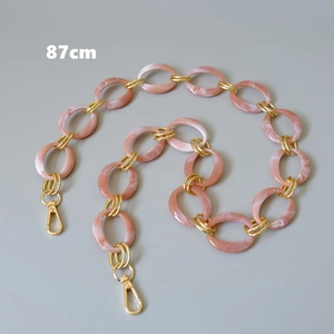 Pink marble resin bag strap with gold chain links and lobster clasps, 87cm length
