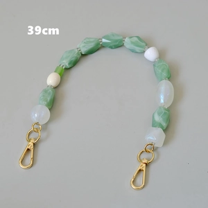 Detail showing 39cm handmade beaded strap with green acrylic beads and gold clasps