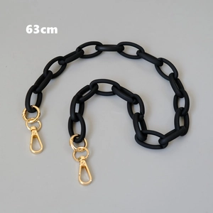 Close-up of a 63cm matte black acrylic chain strap with gold metal lobster clasps
