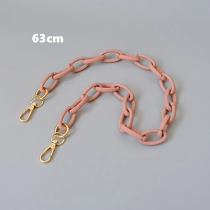 Detail view of a 63cm matte pink acrylic handbag chain with gold metal lobster clasps