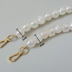 Detailed macro view showing iridescent 2cm resin beads with a gold metal lobster clasp
