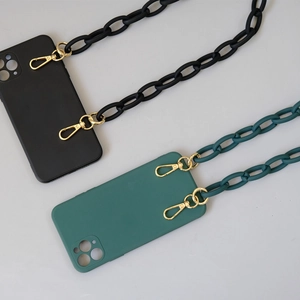 Close-up of matte silicone phone case sets with thick resin chains in black and dark green