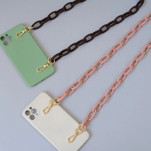 Detail view of matte acrylic phone case chains with golden metal clasp and ring links