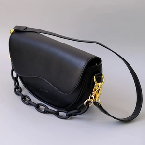 Classic black half-moon saddle bag with resin chain strap and gold hardware