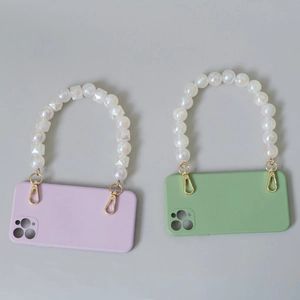 Vintage style phone case with luxury pearl beaded handle in purple and green colors