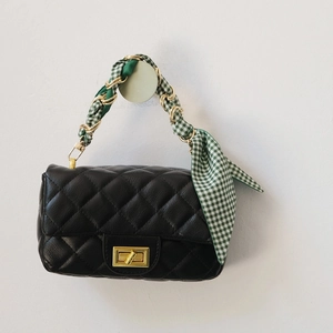 Quilted black leather handbag with gold twist lock and green checkered scarf chain strap