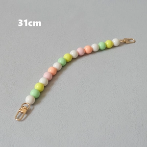 Detail of 31cm colorful handmade macaron beaded chain with golden lobster clasps