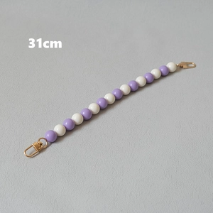 Detail of 31cm handmade purple and white beaded chain accessory with gold lobster clasps
