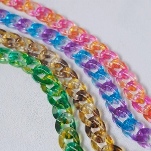 Macro view of colorful resin acrylic link chains for bags and phone DIY crafts